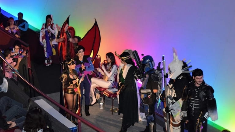 Attendees dressed in cosplay at Cradle Con will be held...