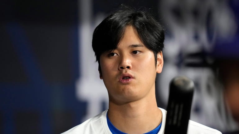 Los Angeles Dodgers designated hitter Shohei Ohtani stands in the...