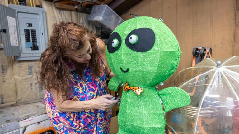 Teacher Michele Anselmo works on an alien for the not-so-spooky walk...