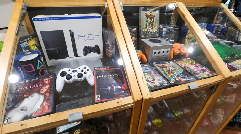 From left: Playstation 2, Game Cube and Nintendo 64 games...