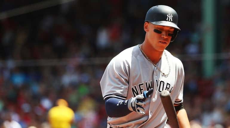Yankees' Aaron Judgereacts after striking out in the first inning...