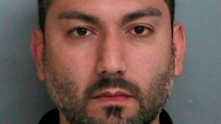 Arash Haghani, 38, of Farmingville, was arrested on Monday, charged with...