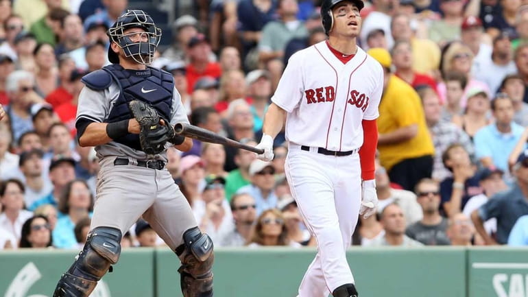 Jacoby Ellsbury of the Boston Red Sox watches his three-run...