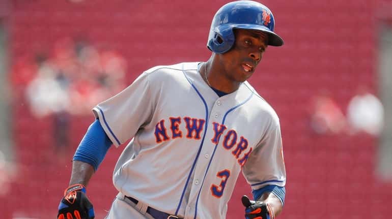New York Mets' Curtis Granderson runs the bases after hitting...