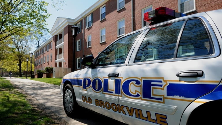 An Old Brookville police car waits at the campus of...