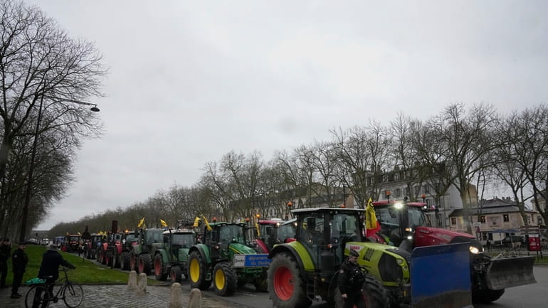 Tractors are parked during a protest, near the Chateau de...