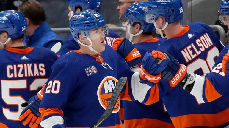 Hudson Fasching #20 of the Islanders celebrates his second period goal...
