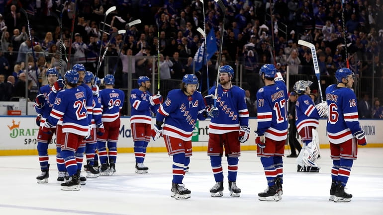 The Rangers celebrate after defeating the Pittsburgh Penguins in Game 2...