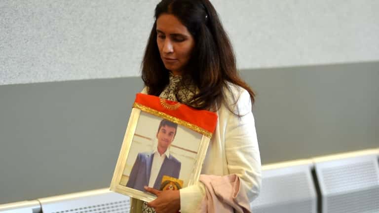 Mala Samtani holds a photograph of her son, NYU freshman...