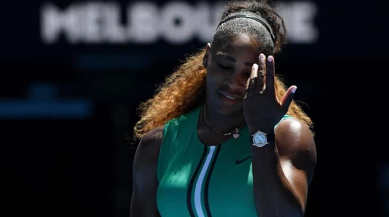 Serena Williams reacts while playing against Karolina Pliskova during their...