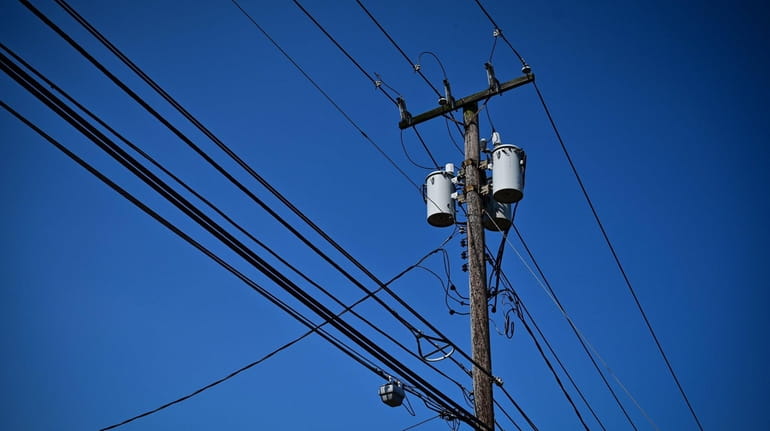 Power lines on utility poles in Smithtown are shown on...