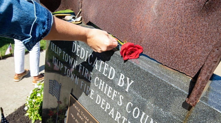 A rose is placed on the 9/11 memorial in Veterans...