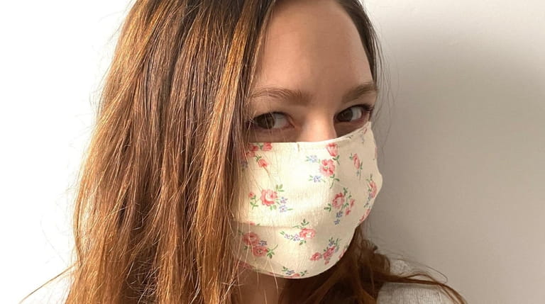 Noelle Ventresca wears a face mask made by her company.