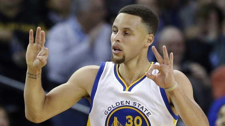 Golden State Warriors' Stephen Curry celebrates after scoring against the...