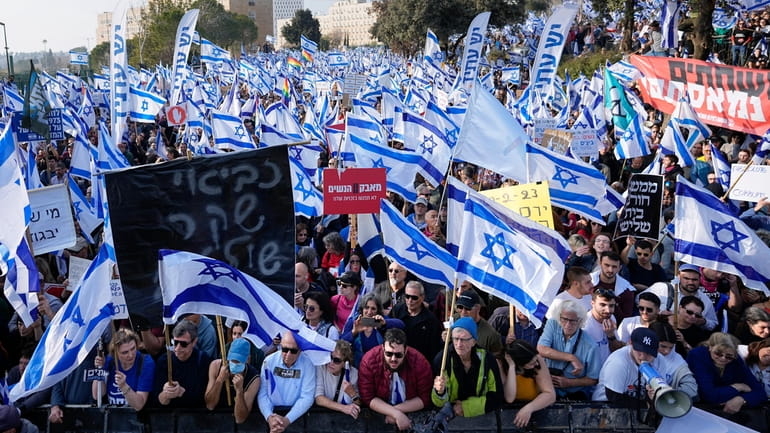 Israelis protest against plans by Prime Minister Benjamin Netanyahu's new...