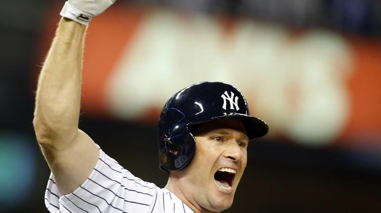Chase Headley of the Yankees celebrates his 14th-inning, game-winning base...