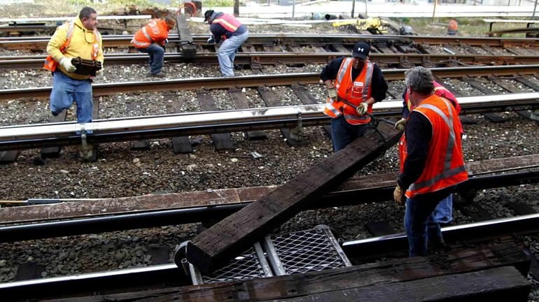 LIRR employees work on completing a major modernization project near...