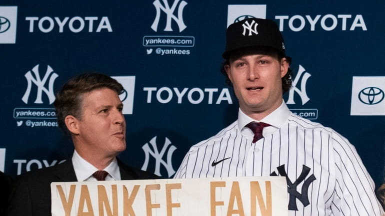 Yankees owner Hal Steinbrenner appears with new Yankees pitcher Gerrit Cole at...