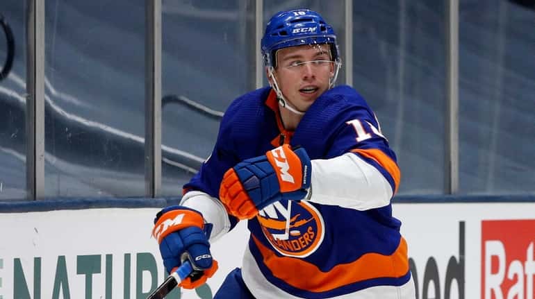 Anthony Beauvillier #18 of the Islanders skates against the Boston Bruins...