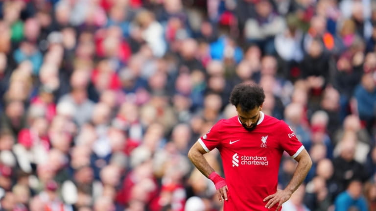Liverpool's Mohamed Salah reacts during the English Premier League soccer...