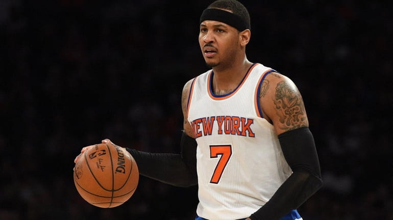 New York Knicks forward Carmelo Anthony brings the ball up...