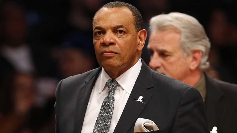 Lionel Hollins of the Brooklyn Nets walks off the court...