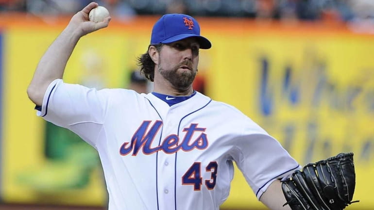 NY Mets pitcher R.A. Dickey delivers in the eighth inning...