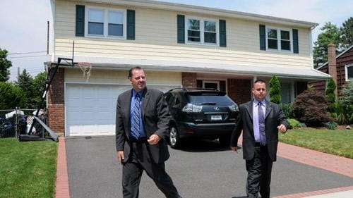 Homicide detectives leave Jeffrey Locker's home in Valley Stream after...