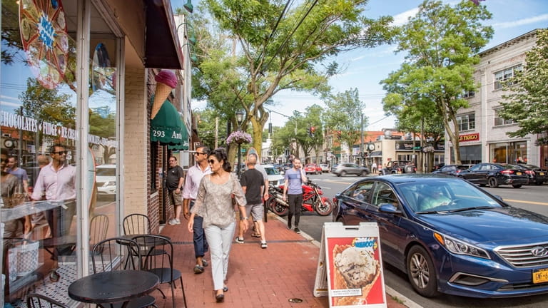 Shoppers in the walkable downtown stretch of Huntington.