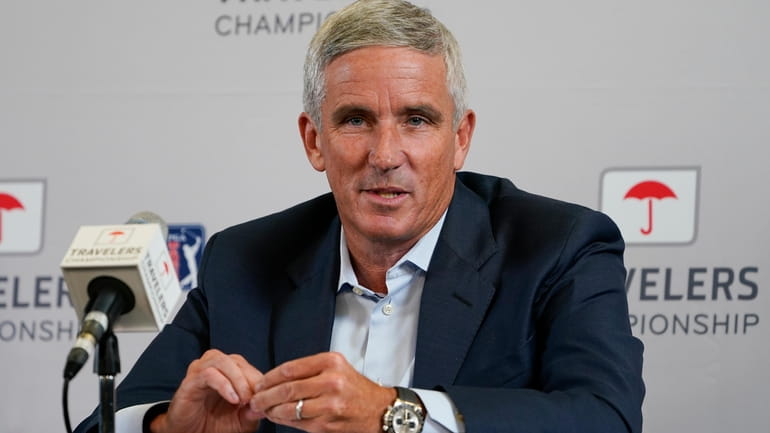 PGA Tour Commissioner Jay Monahan speaks during a news conference...