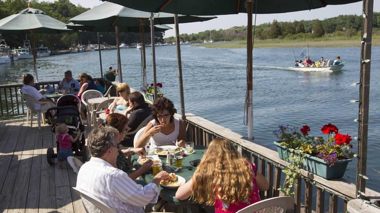 The Old Mill Inn in Mattituck offers outdoor dining that...