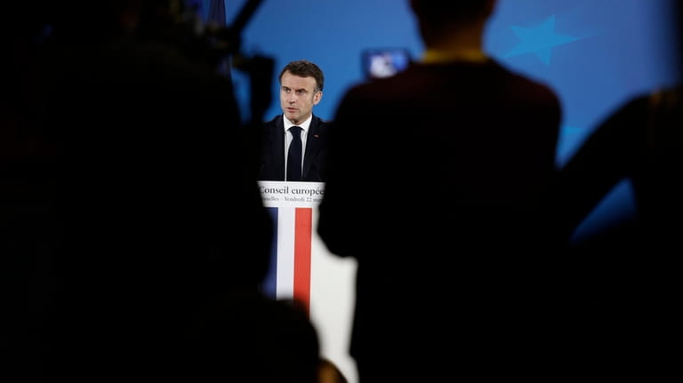 French President Emmanuel Macron addresses a media conference at the...