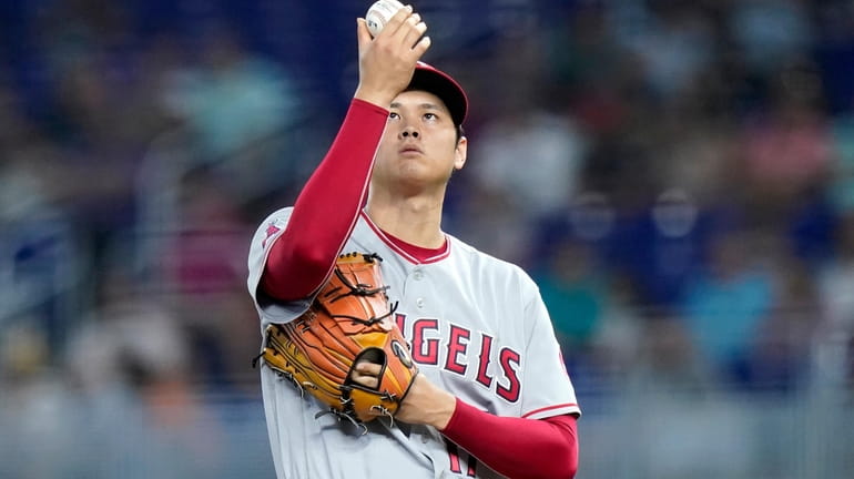 Los Angeles Angels starting pitcher Shohei Ohtani prepares to throw...