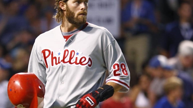 Philadelphia Phillies' Jayson Werth looks toward the pitcher after striking...