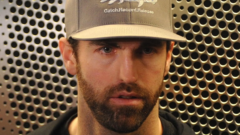 Andrew Ladd speaks with the media after Islanders player exit...