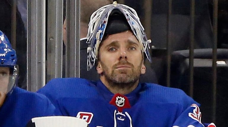 Henrik Lundqvist of the New York Rangers sits on the...