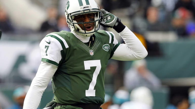 Geno Smith walks to the sidelines after losing possession in...