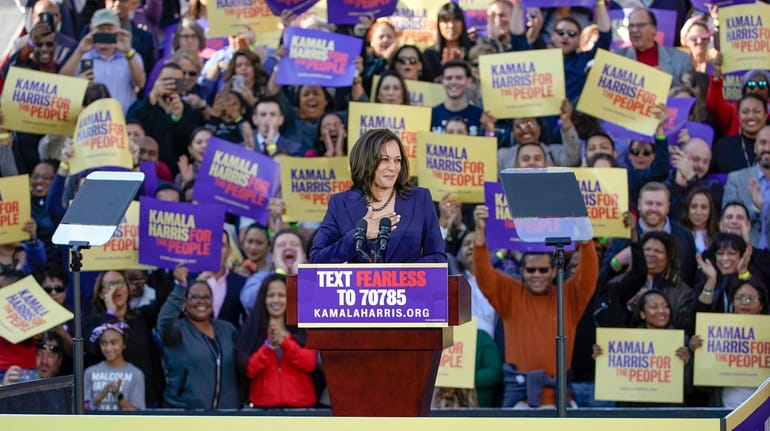 Democratic Sen. Kamala Harris, of California, acknowledges the crowd as...