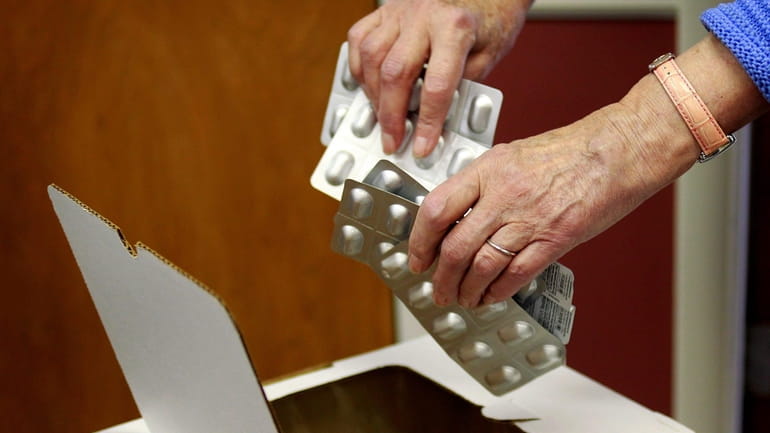 Residents drop off unused prescription drugs at the Port Washington Police...