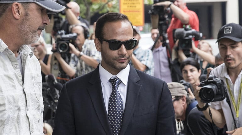 Former Trump campaign aide George Papadopoulos leaves U.S. District Court...