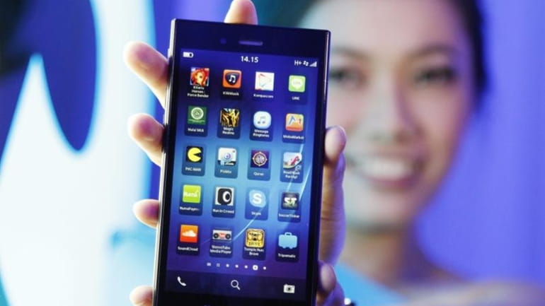 A Blackberry Z3 smartphone is shown by a model during...
