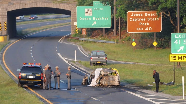 State Police troopers stand at the scene of a fatal...