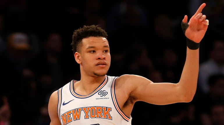 Kevin Knox #20 of the Knicks reacts after a basket...