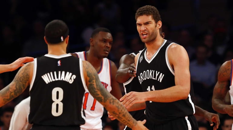 Brook Lopez of the Brooklyn Nets reacts after a basket...