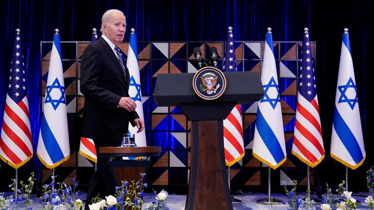 President Joe Biden walks to the podium to deliver remarks...