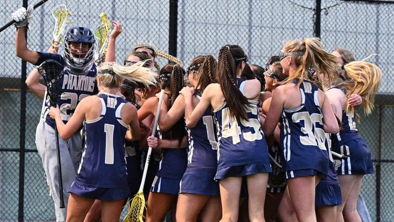 Bayport-Blue Point celebrates its victory over Manhasset in the Long...