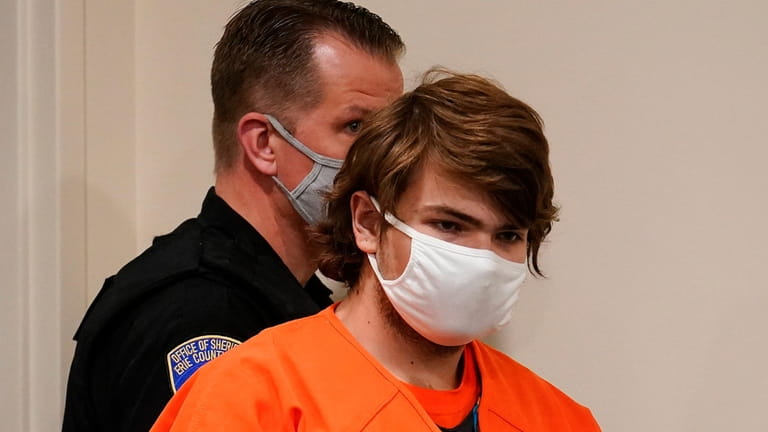 Payton Gendron, the alleged Buffalo shooter, is led into the...