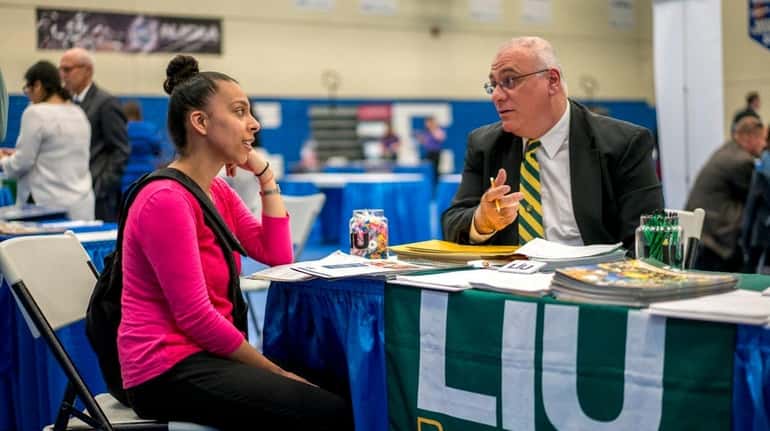 Dowling College student Stephanie Rubio, of Brentwood, left, meets with...