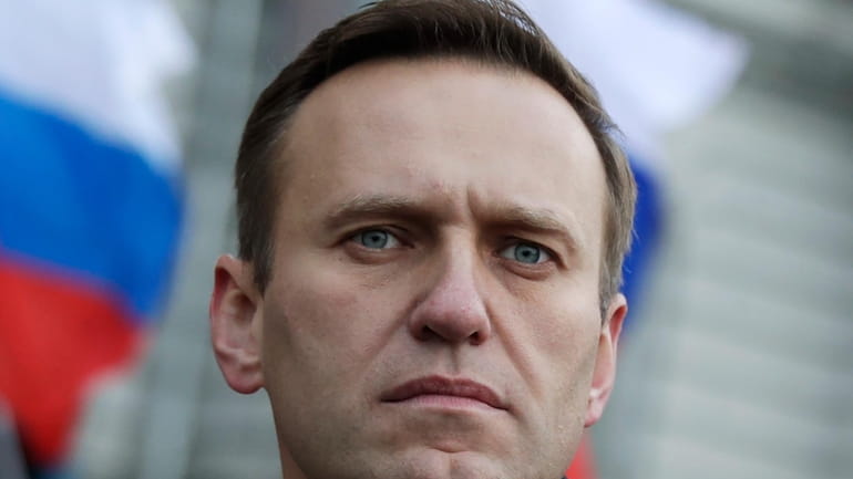 Russian opposition activist Alexei Navalny takes part in a march...