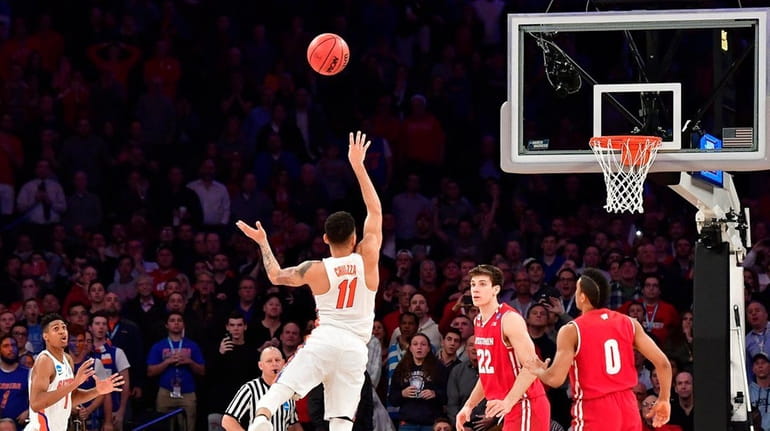 Florida's Chris Chiozza lets the winning three-pointer fly just before...